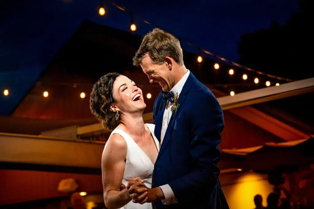 A couple laughing while sharing their first dance