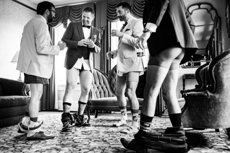 Groom gets ready in his underwear at Hotel Boulderado in Boulder, Colorado