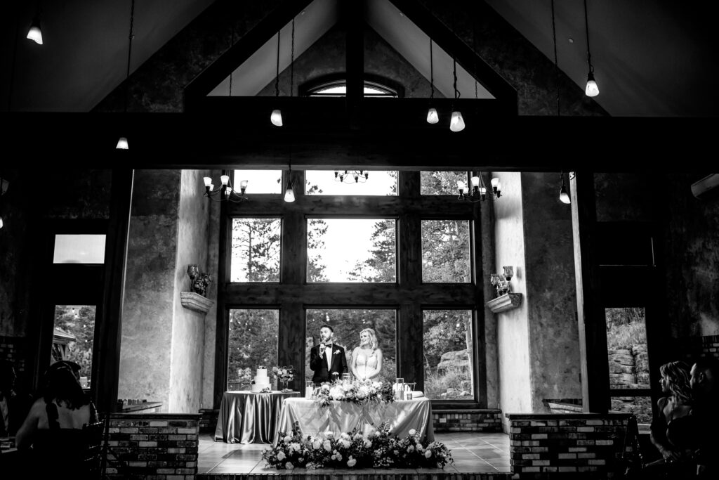 A bride and groom make a welcome toast during the reception of their Della Terra Mountain Chateau wedding