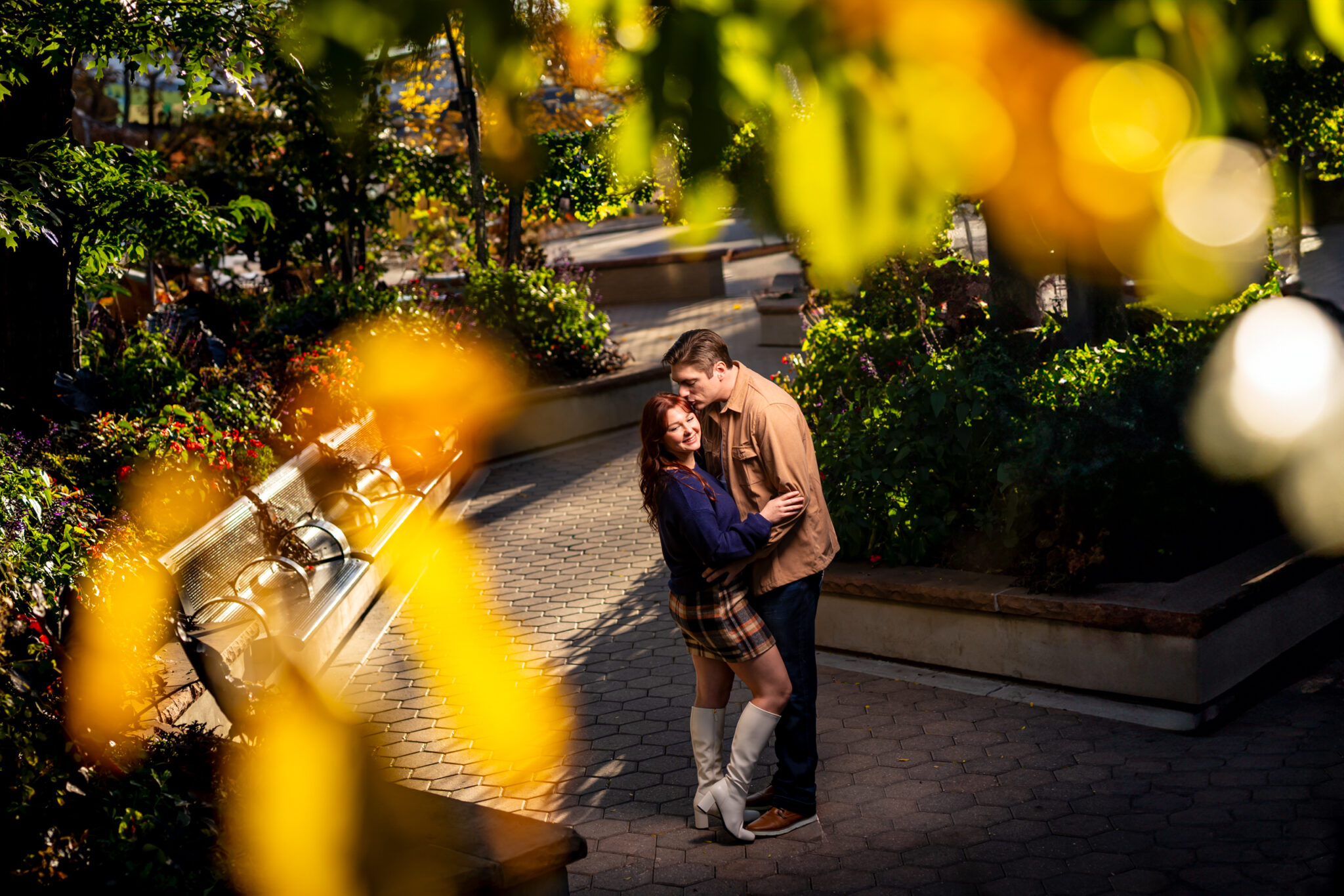 Jessa and Reid's Fort Collins engagement photos downtown in Old Town Square in the fall.