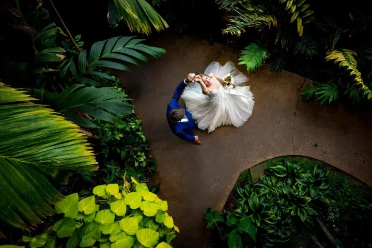 A documentary style wedding photography of a couple dancing at the Denver Botanic Gardens in Colorado