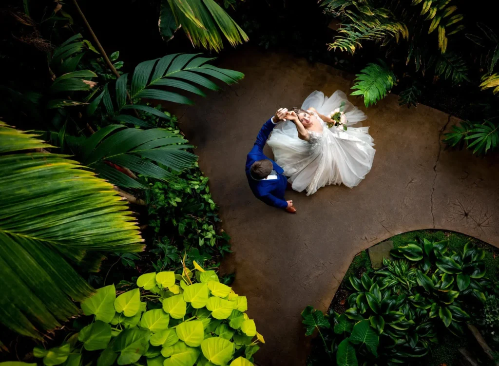 A documentary style wedding photography of a couple dancing at the Denver Botanic Gardens in Colorado