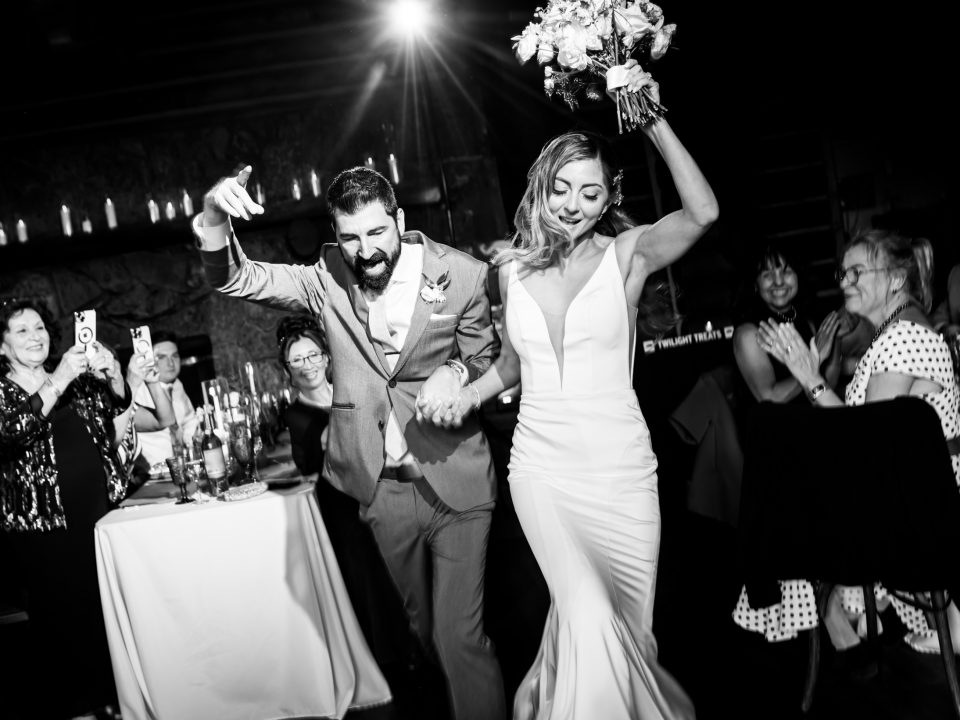 Bride and groom dance into their grand entrance during their Dao House wedding reception