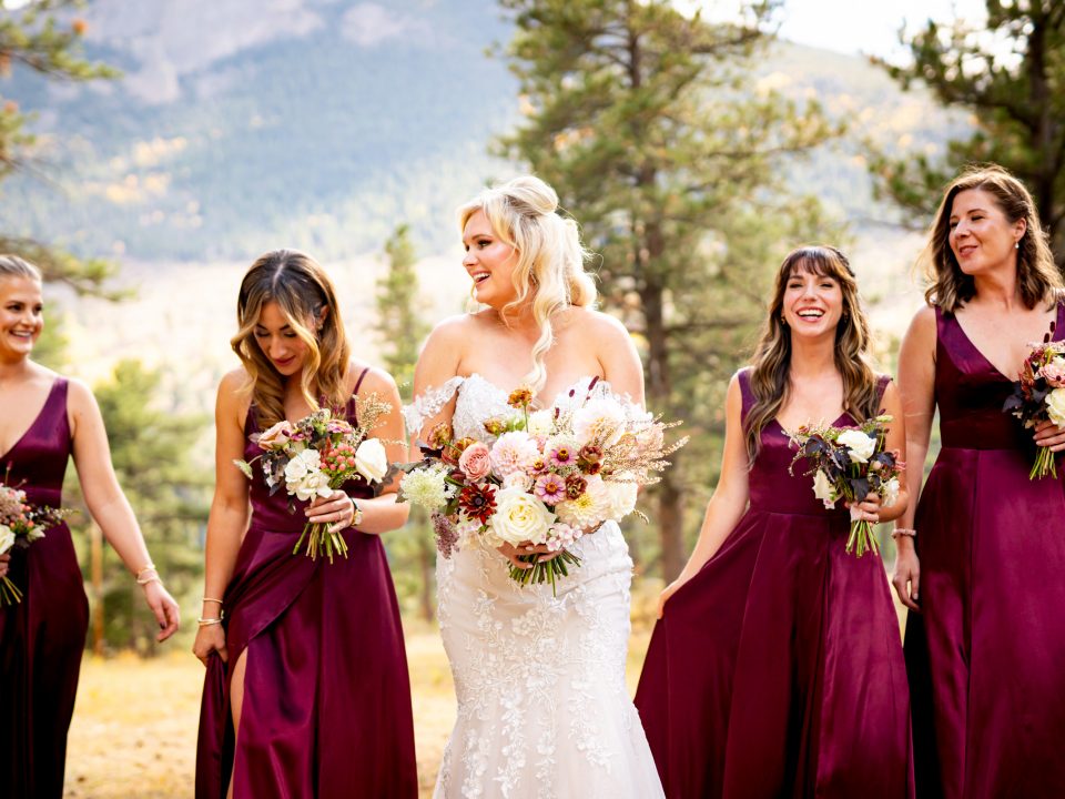 A bride walks with her bridesmaids during her Della Terra Mountain Chateau wedding