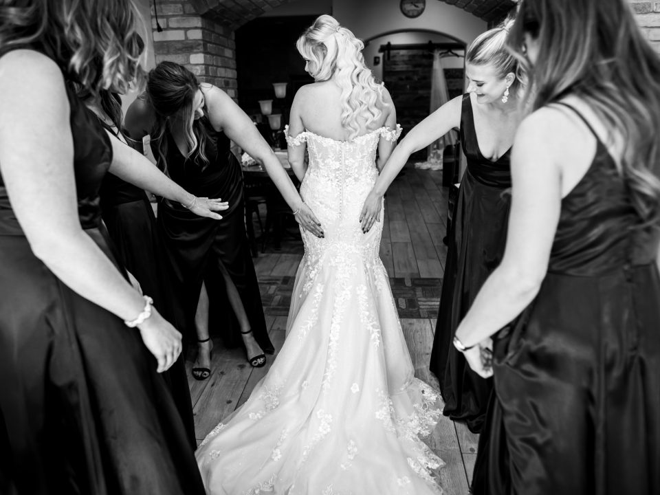 Bridesmaids tap the tush of a bride during a Della Terra Mountain Chateau wedding